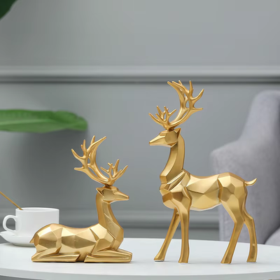2Stück™ – Geometrische Goldene Elch-Skulptur aus Harz